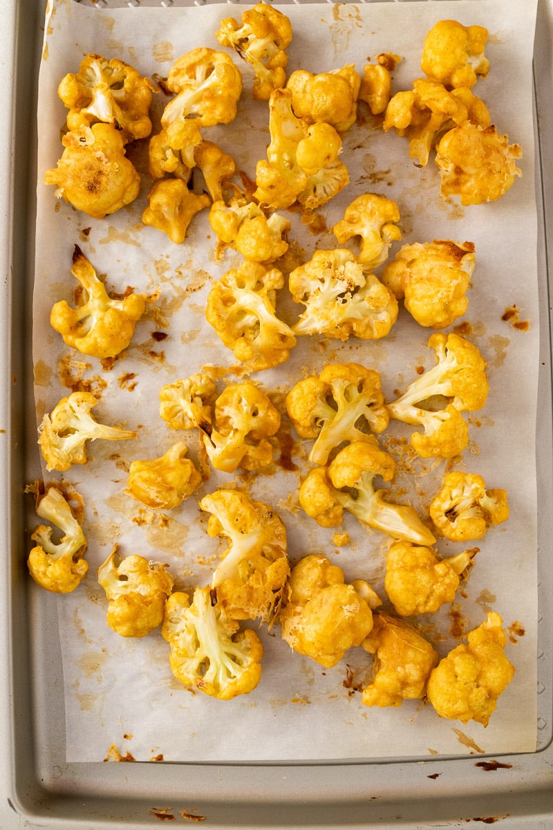 baked buffalo cauliflower bites on baking tray without sauce