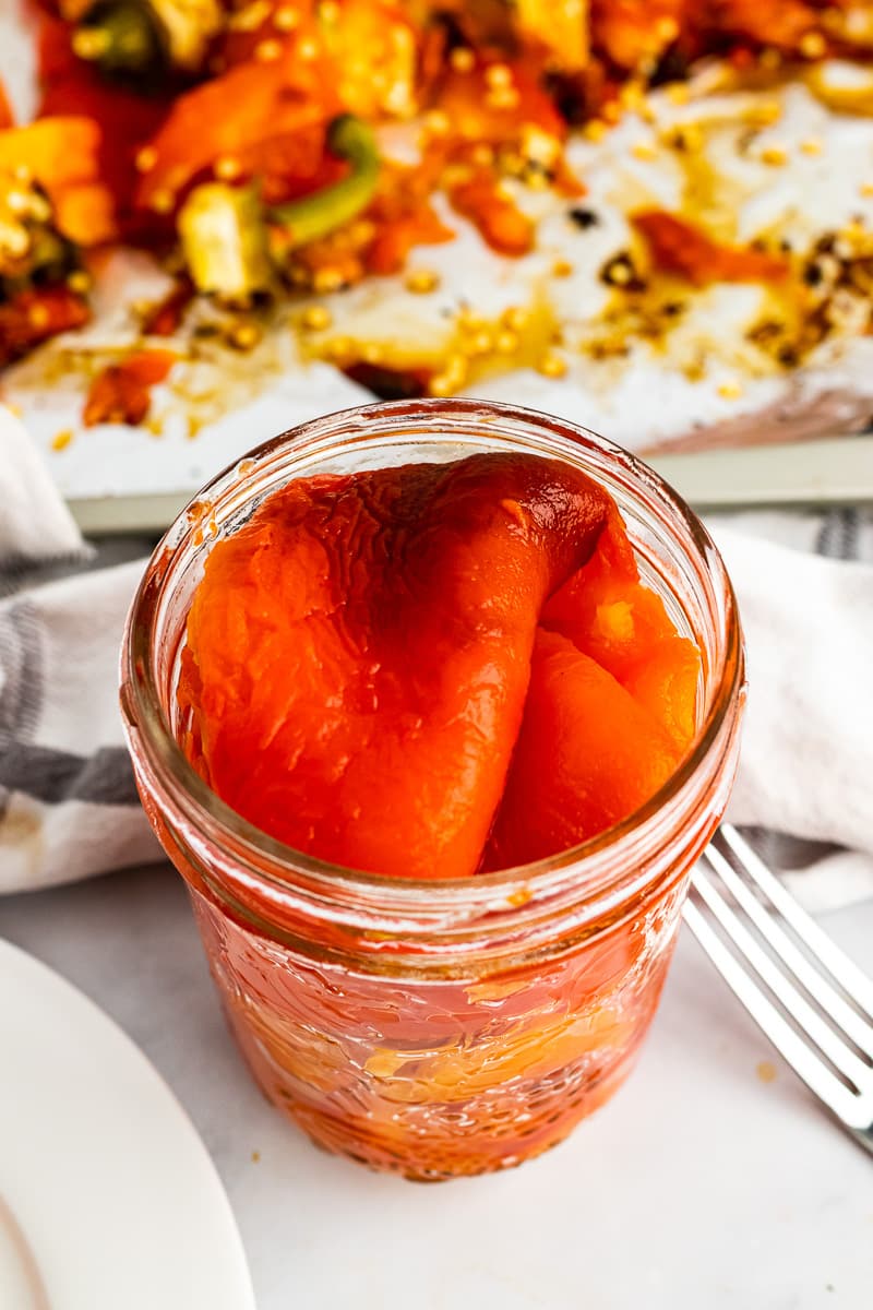 top view oven roasted peppers in jar