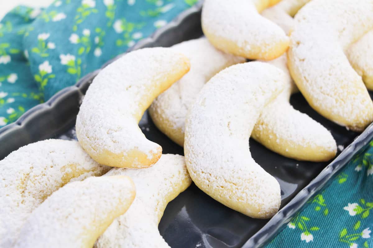 serving plate full of italian almond crescent cookies