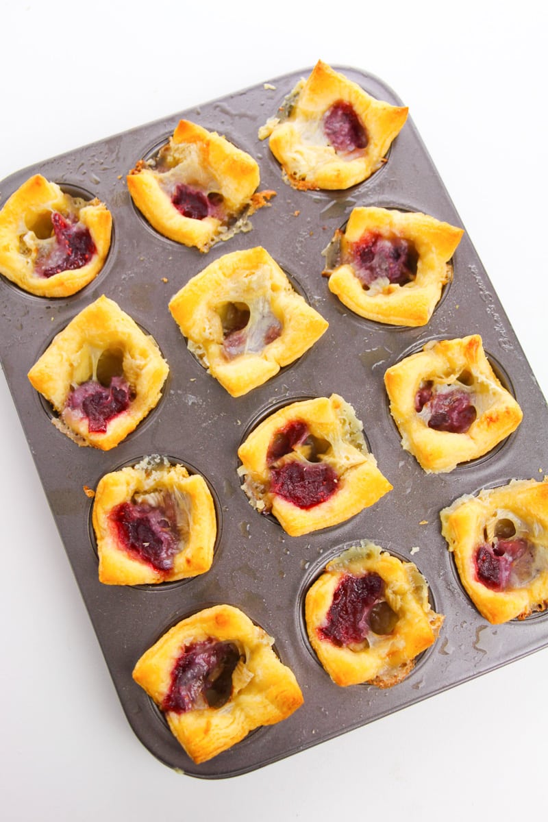 baked cranberry brie bites in a muffin tin