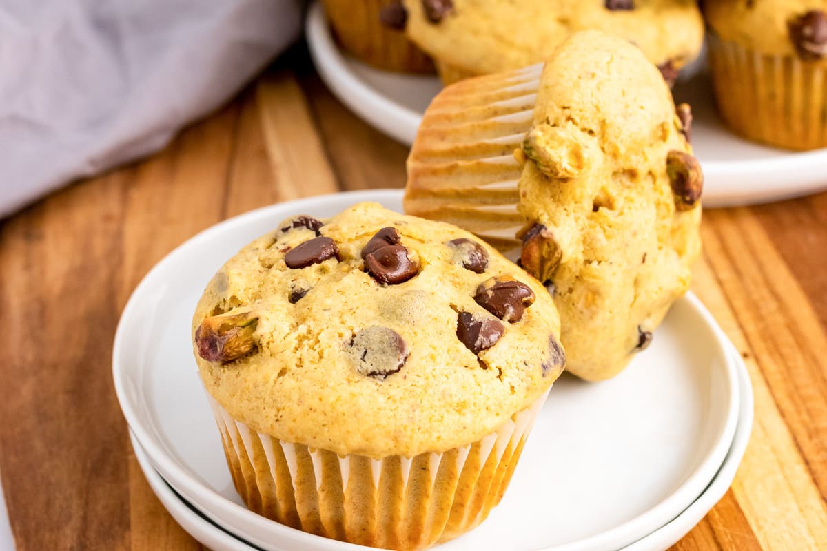 side view of chocolate chip banana bread muffins on a plate