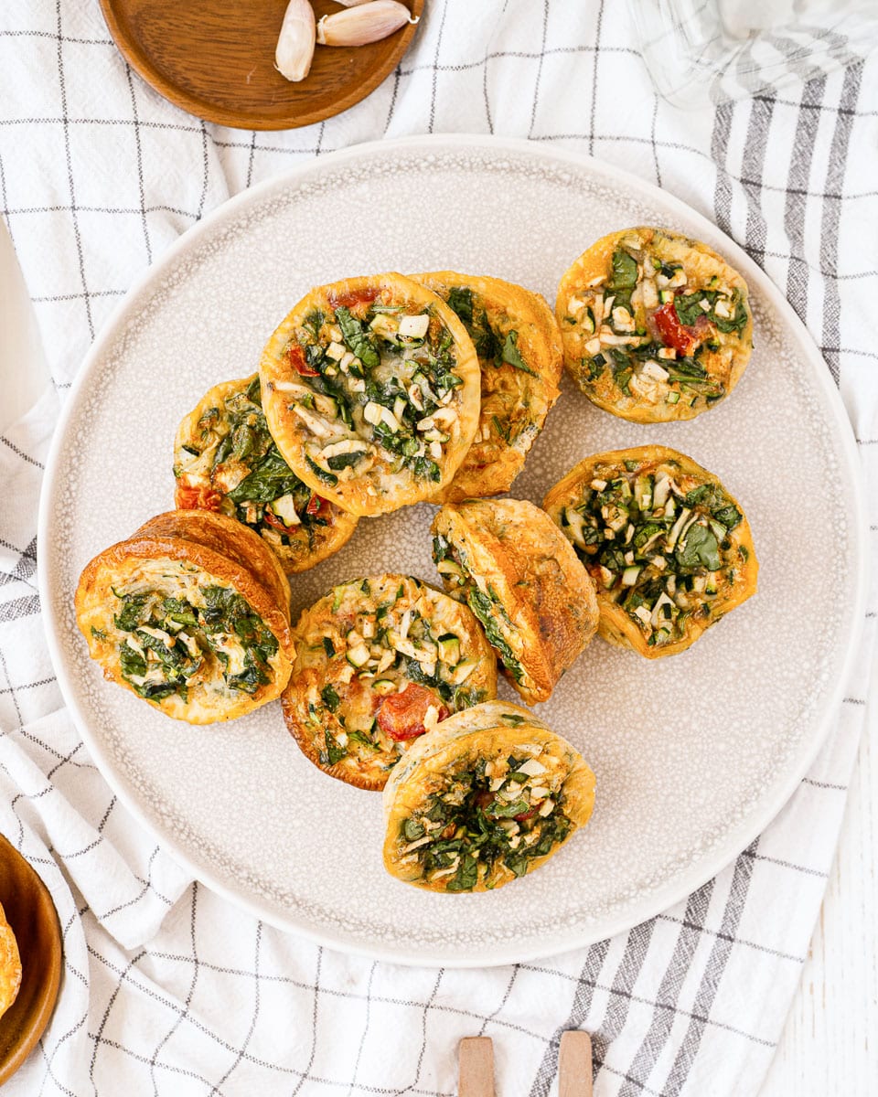 top view large plate of muffin tin egg bites sit-in non dish towel