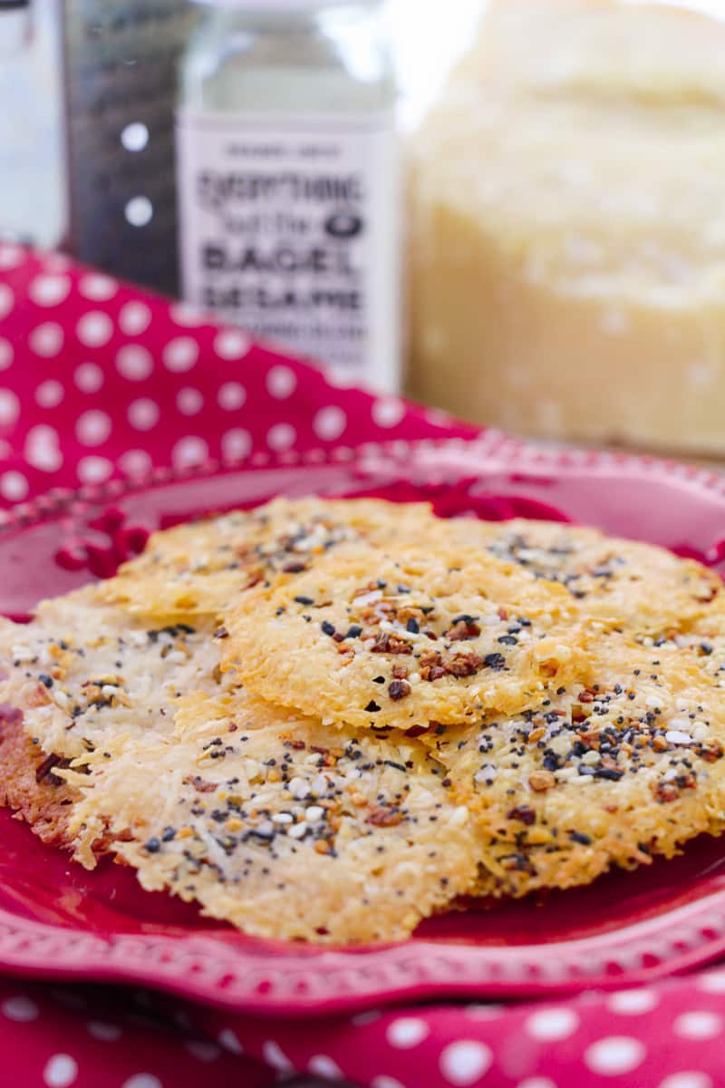 stack of easy parmesan crisps on red plate