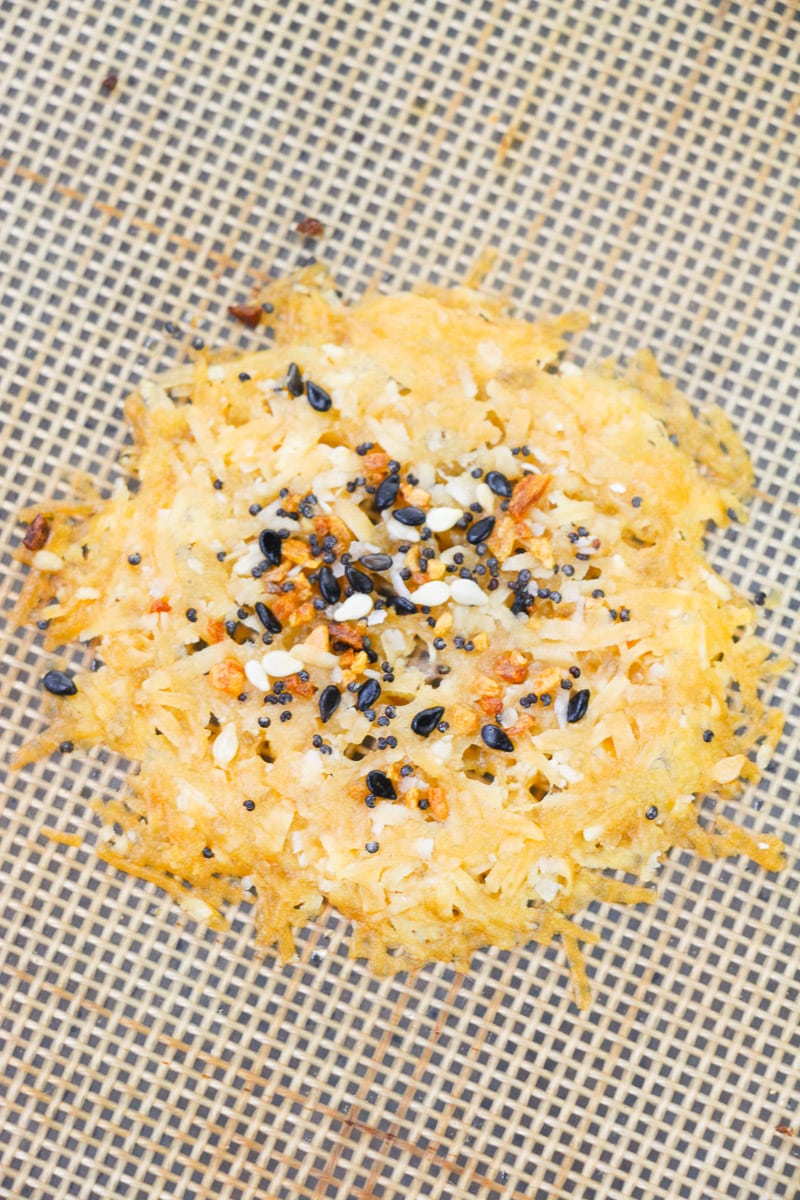 close up single parmesan crisp on baking sheet
