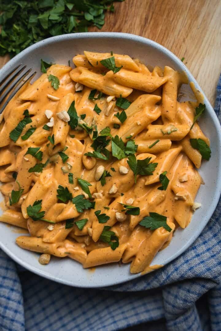 Vegan pasta with a cheesy vegetable sauce