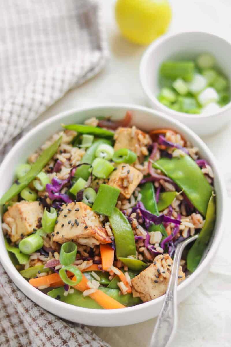 Tofu rice stir-fry with almond butter and vegetables