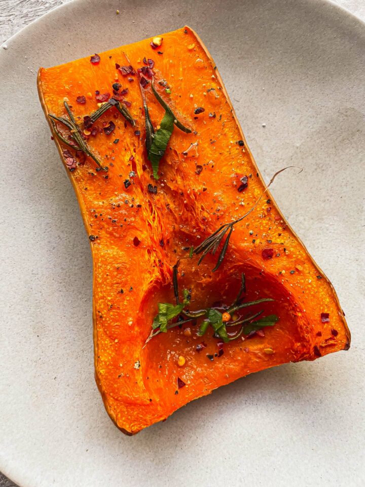 Baked butternut squash half on a plate