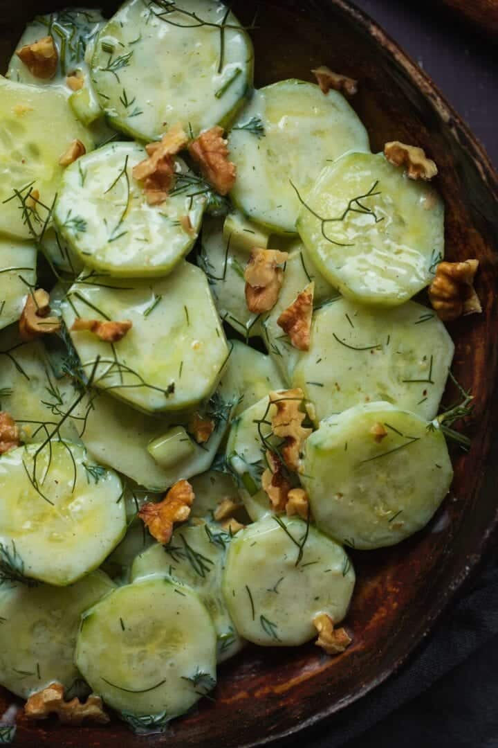 Bowl of Polish cucumber salad with a dairy-free dressing