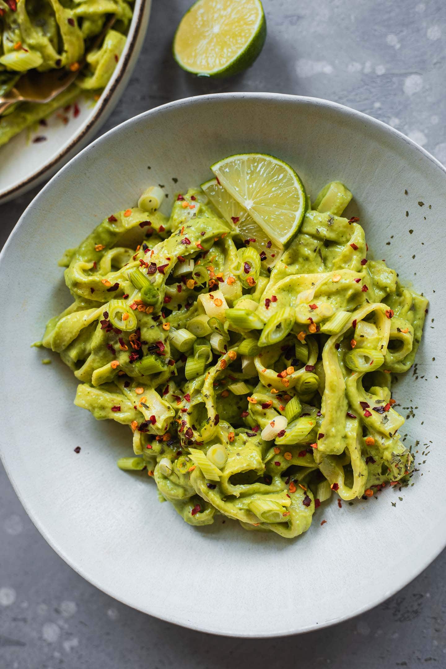 Bowl of avocado pasta with lime