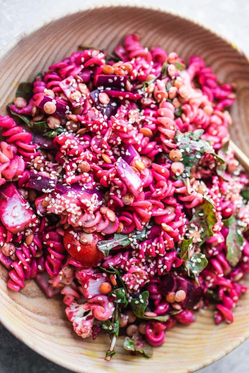 Bowl of beetroot pasta salad with green lentils
