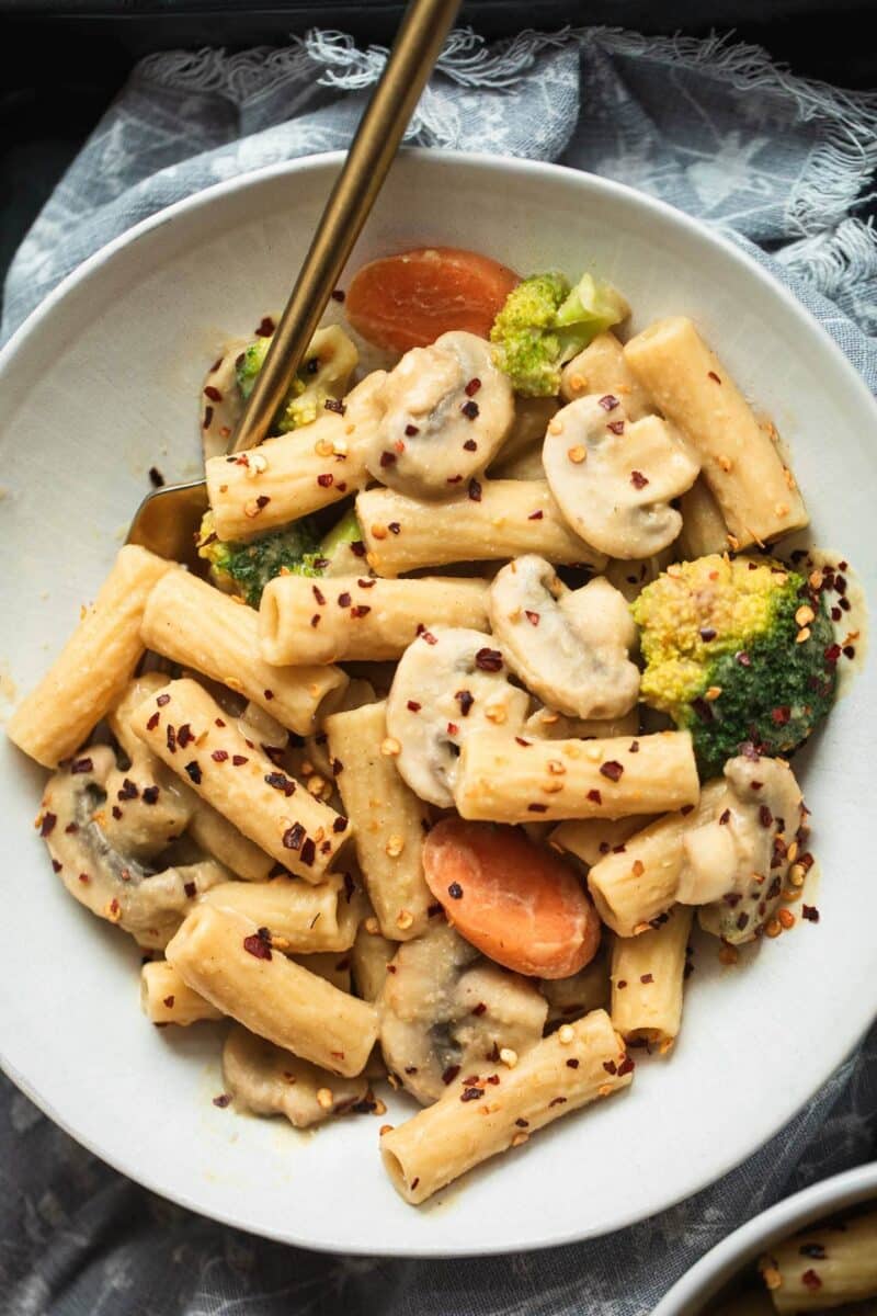 Bowl of pasta with vegetables and a butter bean sauce