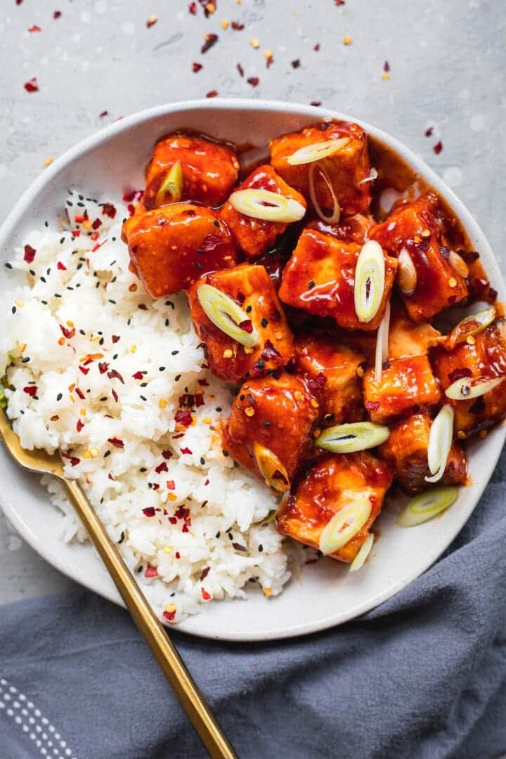 Bowl of tofu in a BBQ sauce with rice
