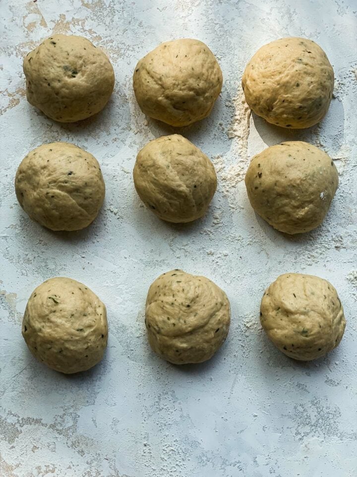 Bread dough rolls on a table
