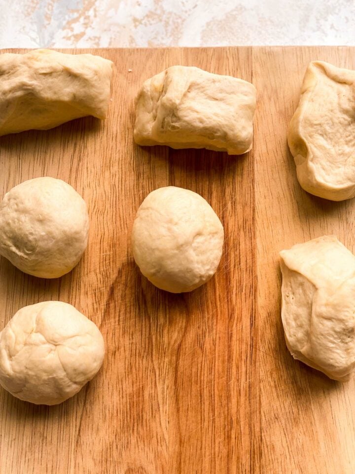 Bread roll dough on a wooden board