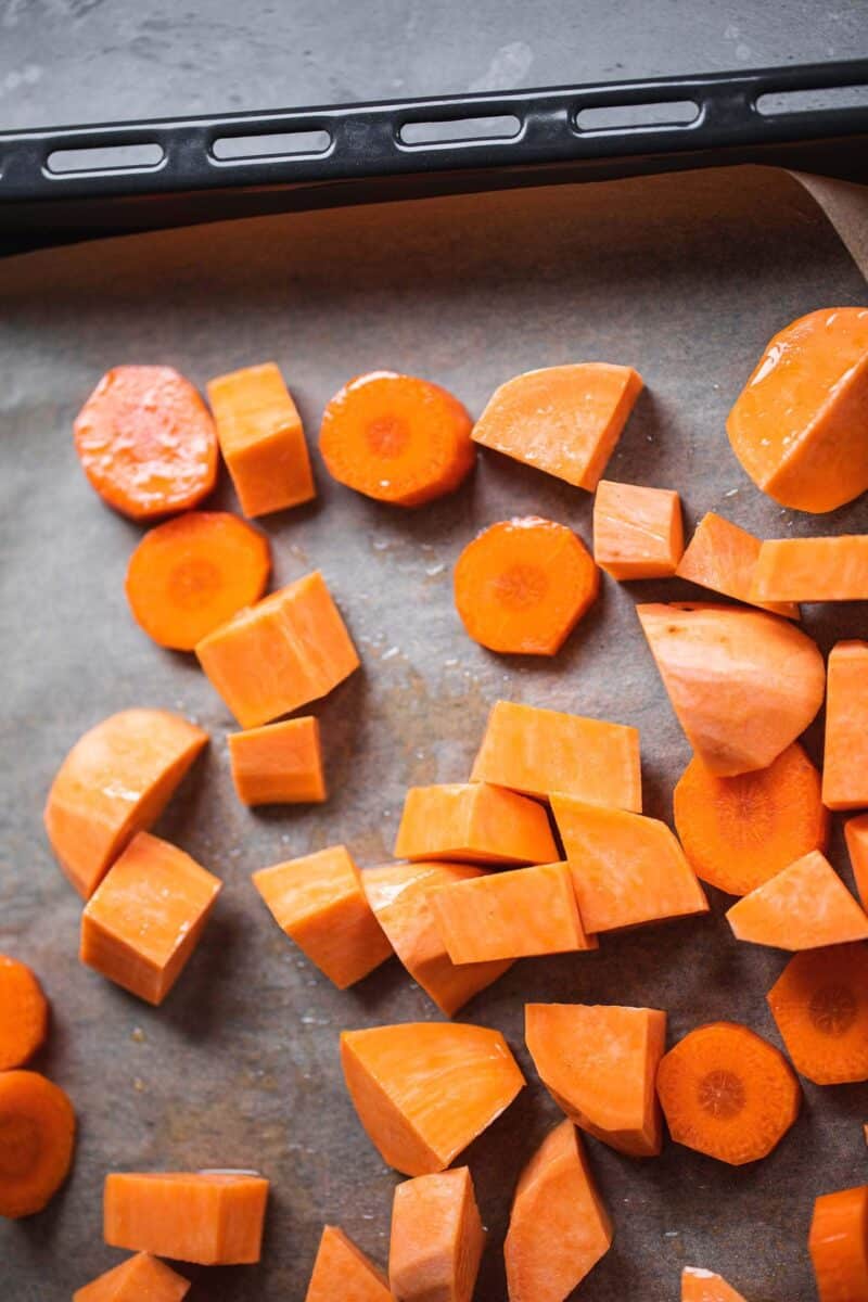 Carrot and sweet potato on a baking tray