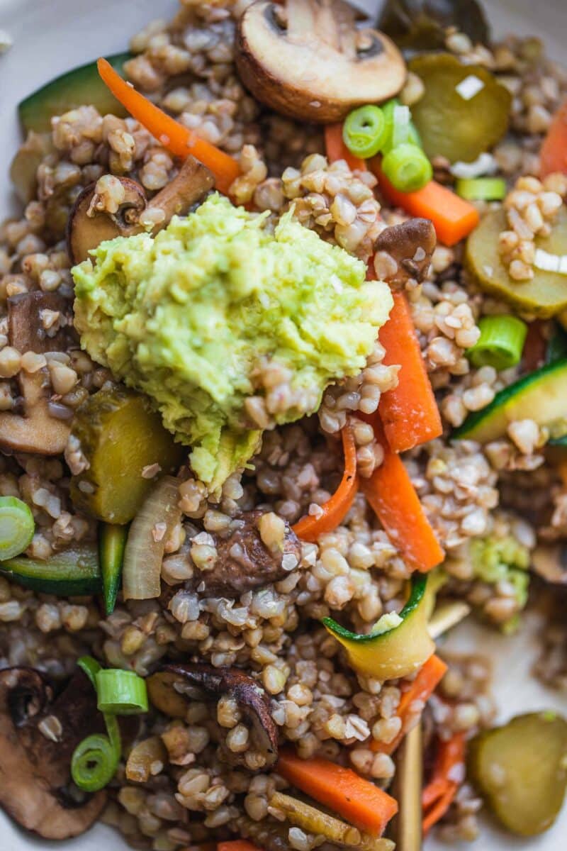 Closeup of buckwheat with vegetables and avocado