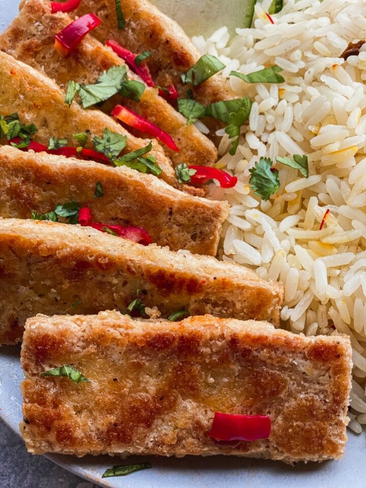 Closeup of crispy tofu with rice