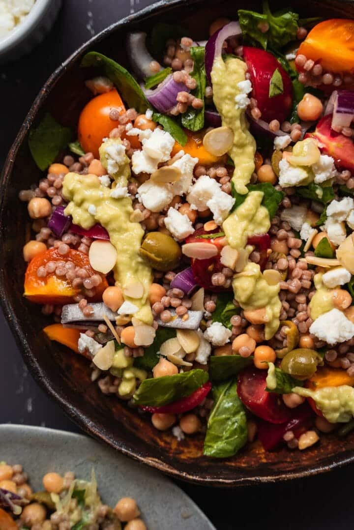 Closeup of vegan salad with feta and vegetables