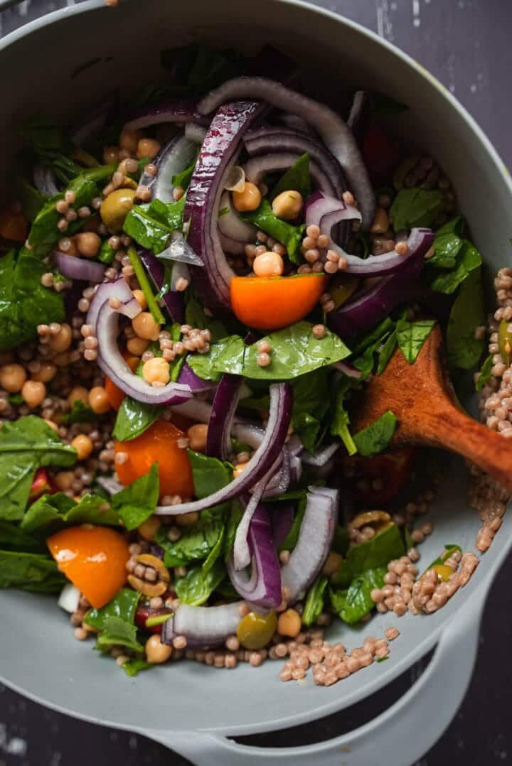 Couscous salad in a mixing bowl
