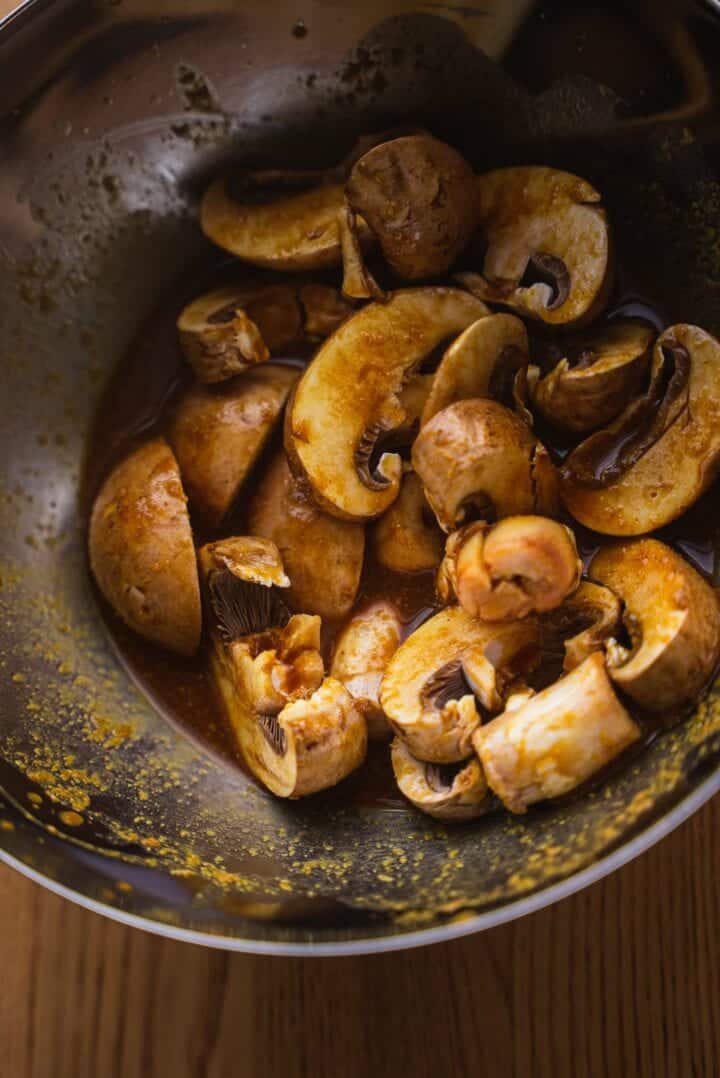 Cremini mushrooms in a mixing bowl