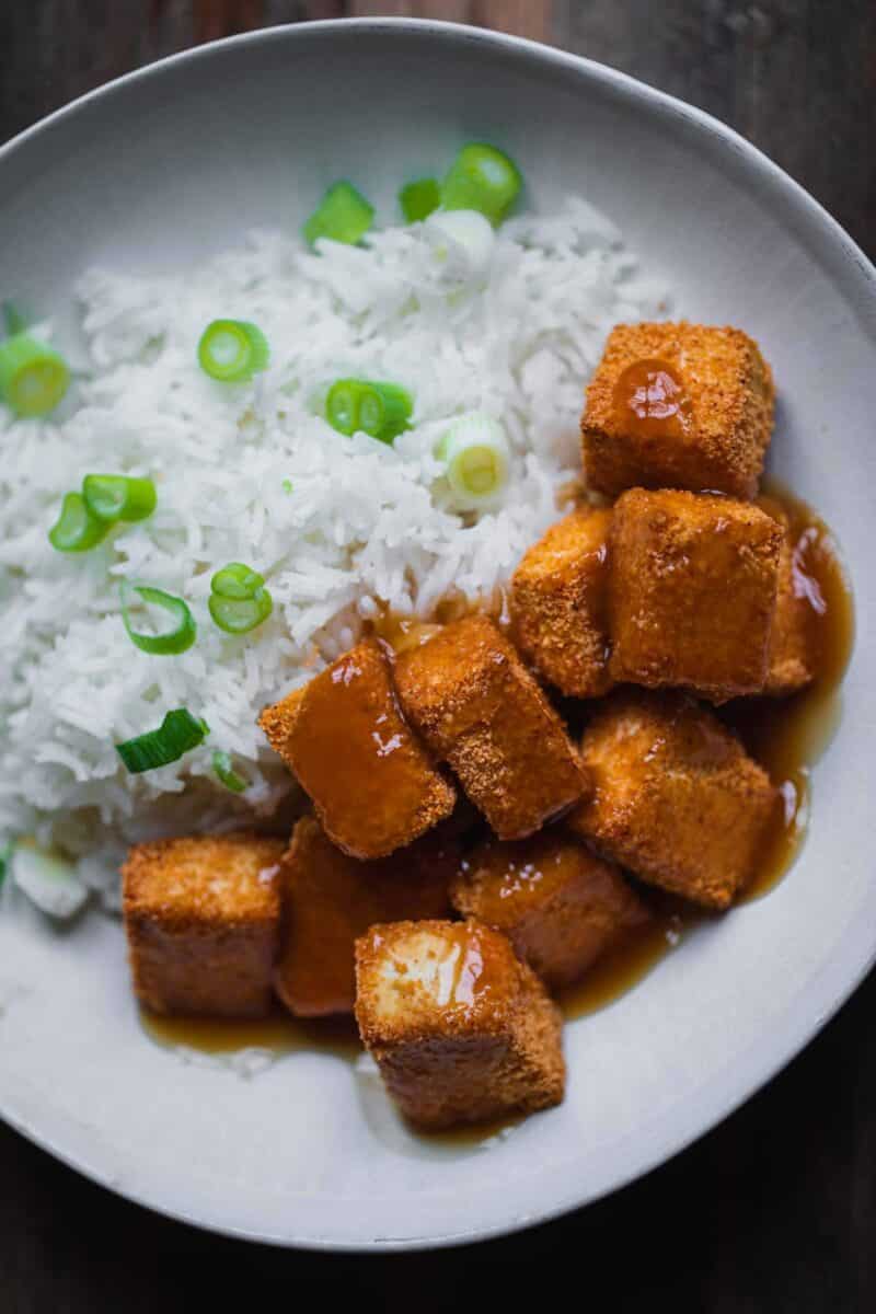 Crispy baked tofu with rice and a sweet and sour sauce