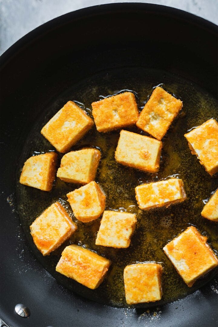 Crispy tofu in a frying pan