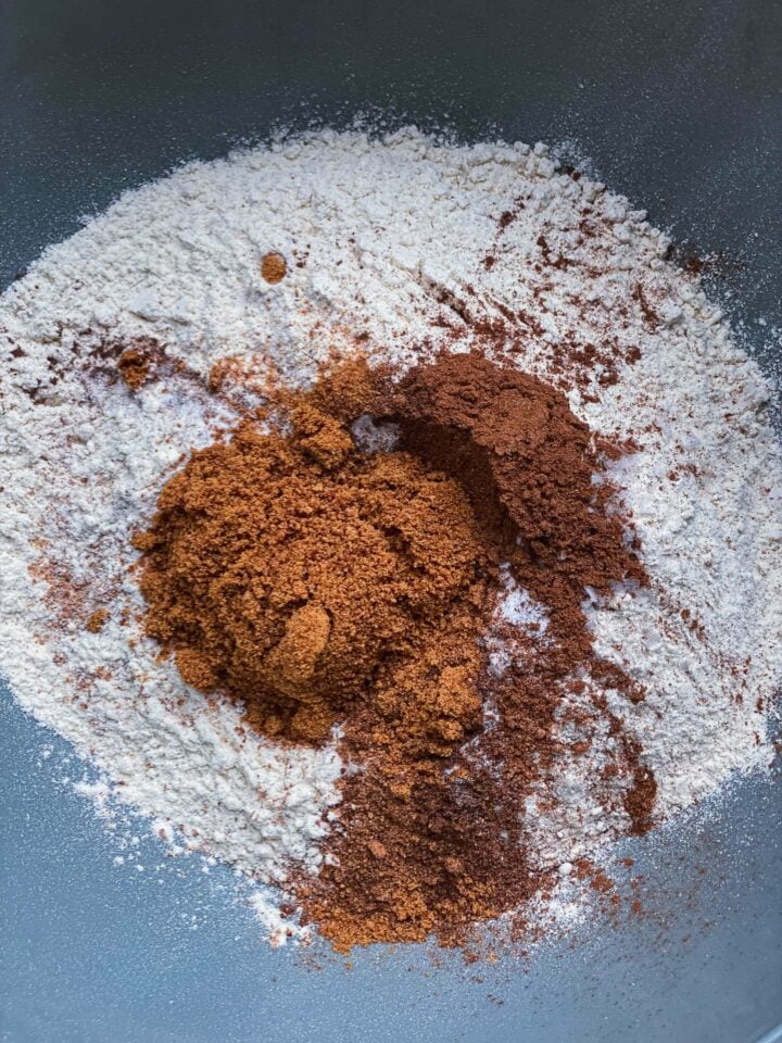 Dry ingredients for pumpkin bread in a mixing bowl
