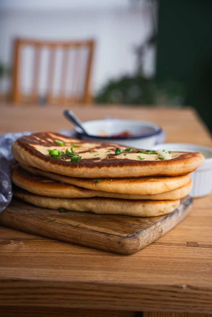 Eggless naan bread on a table