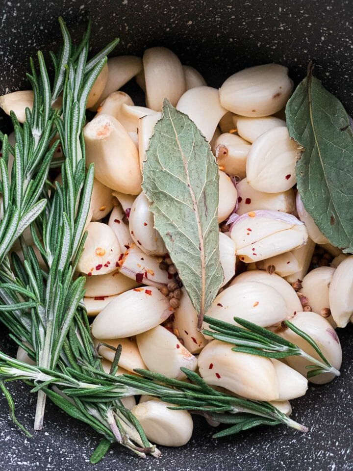 Garlic and herbs in a saucepan