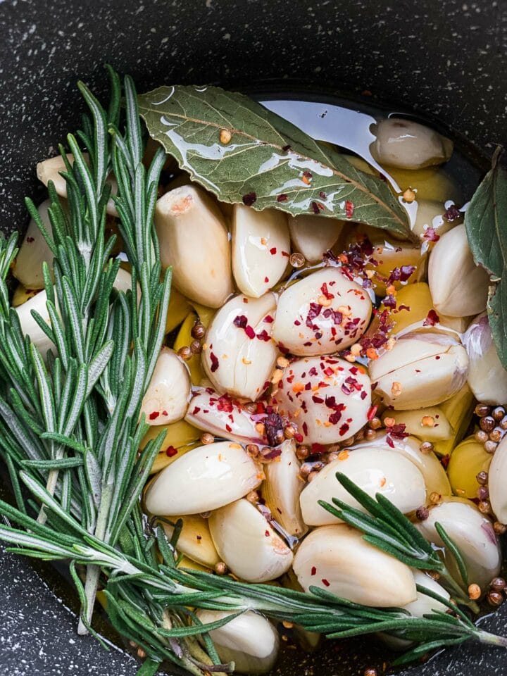 Garlic, herbs and olive oil in a saucepan