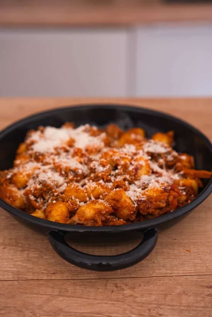 Gnocchi with a cheesy tomato sauce in a baking dish