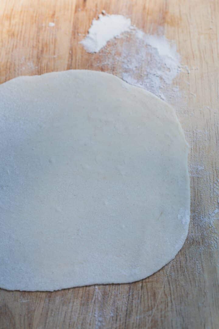 Khinkali dough on a wooden board