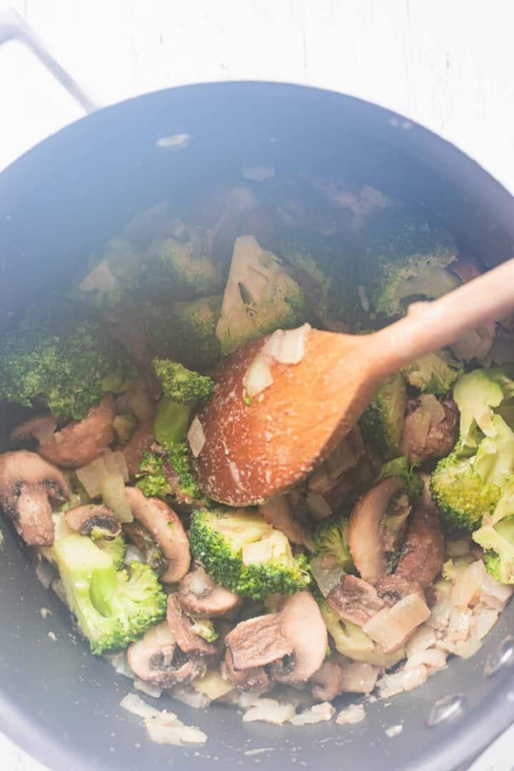 Mushrooms and broccoli in a saucepan