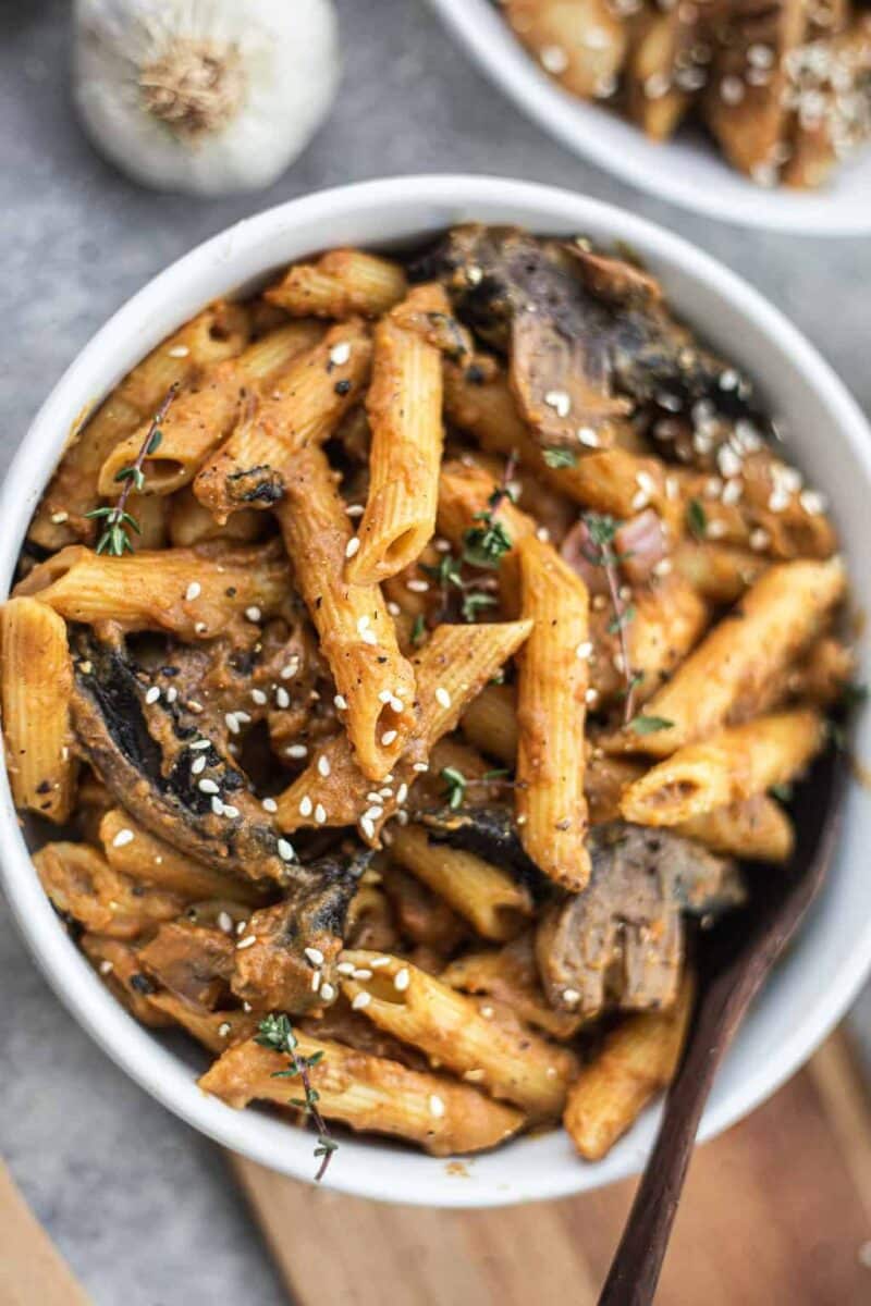 Vegan pasta with mushrooms in a white bowl