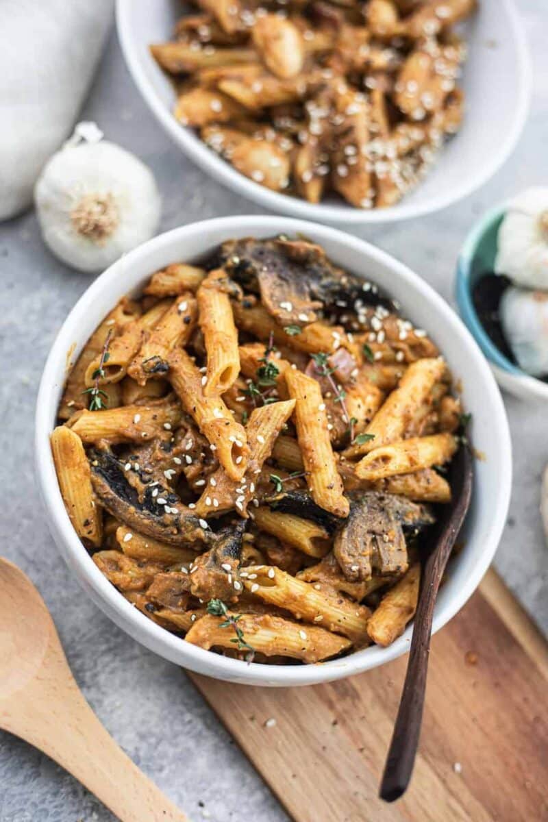 Bowl of vegan pasta in a creamy sauce with portobello mushrooms