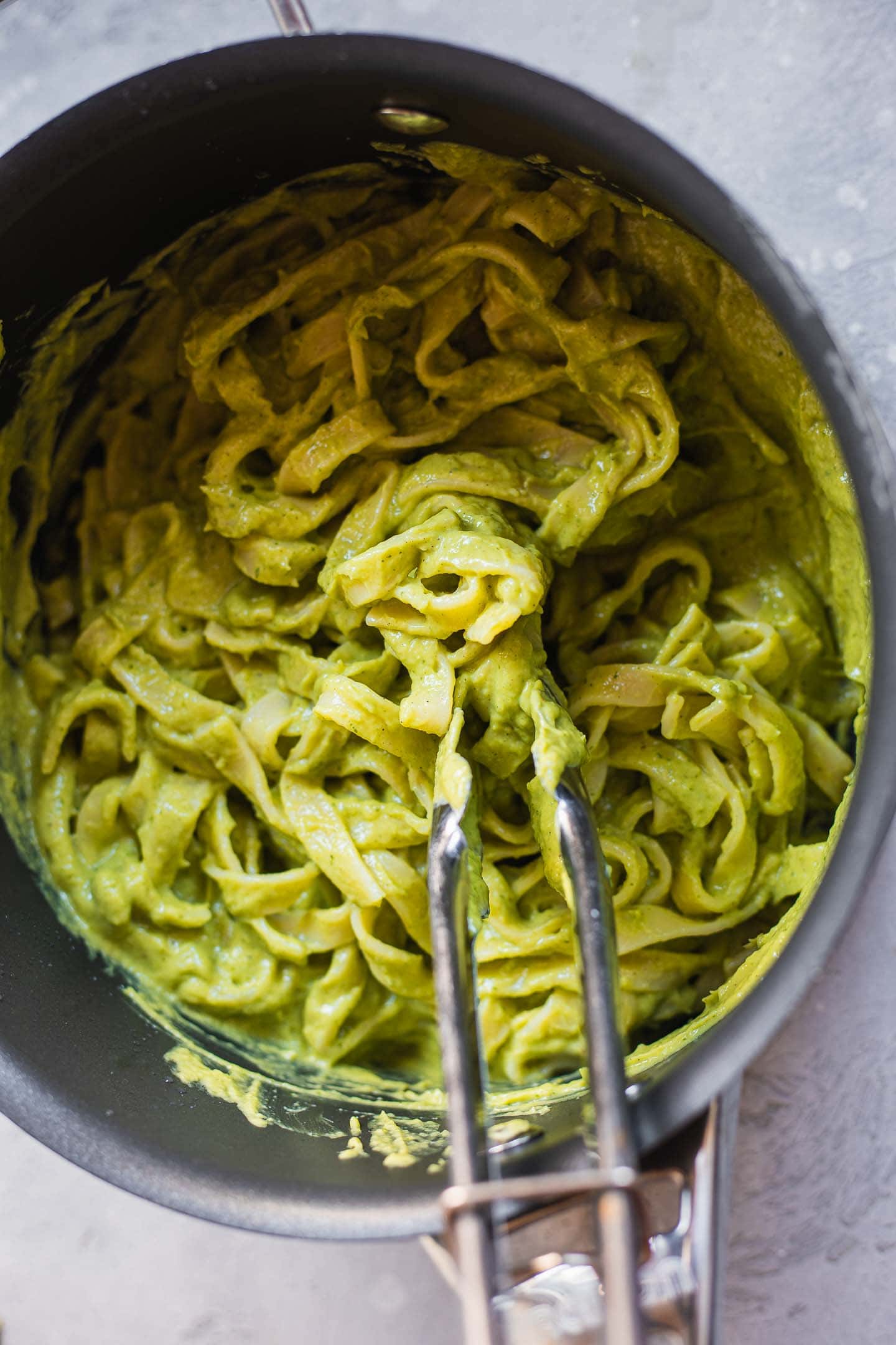 Pasta with avocado sauce in a pan