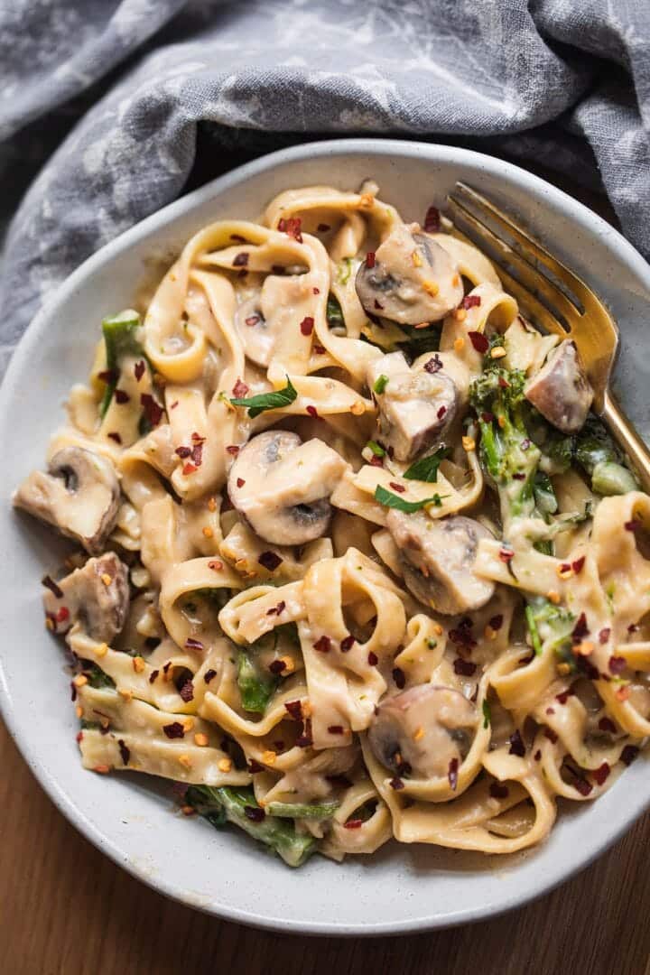 Pasta with broccoli and mushrooms in a bowl