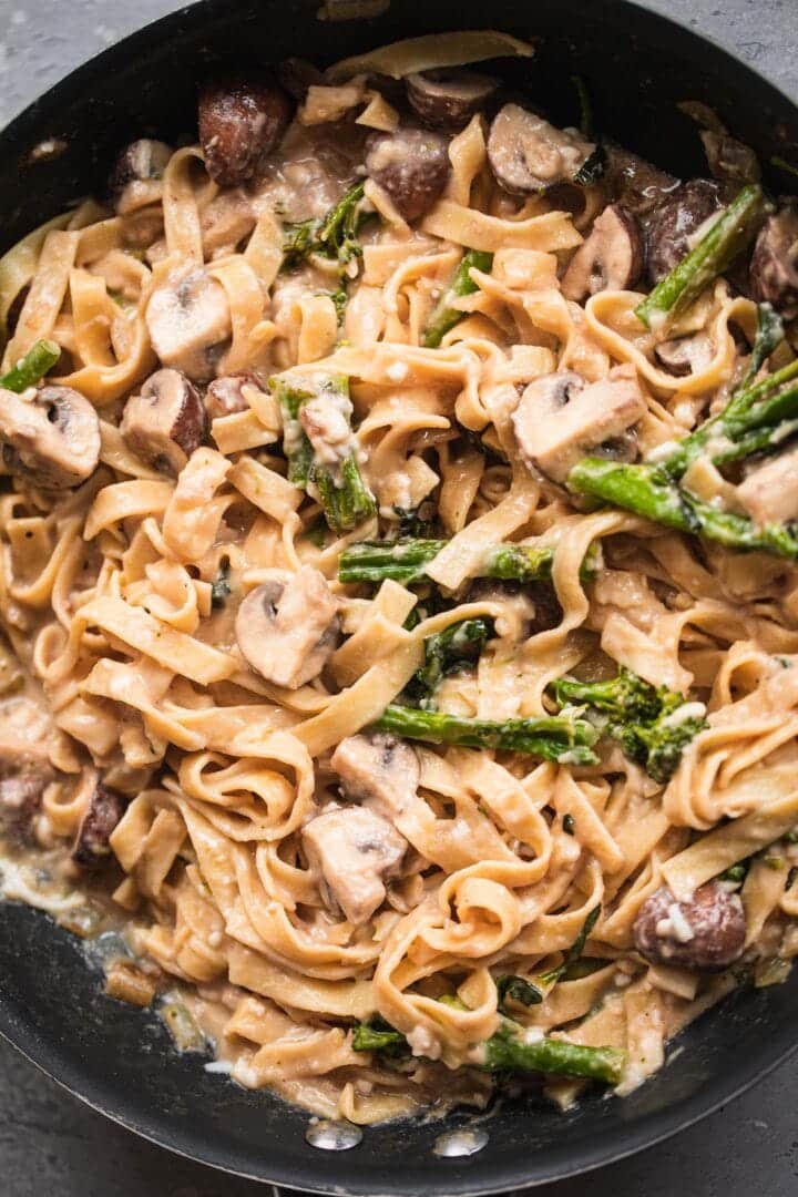 Pasta with broccoli and mushrooms in a frying pan