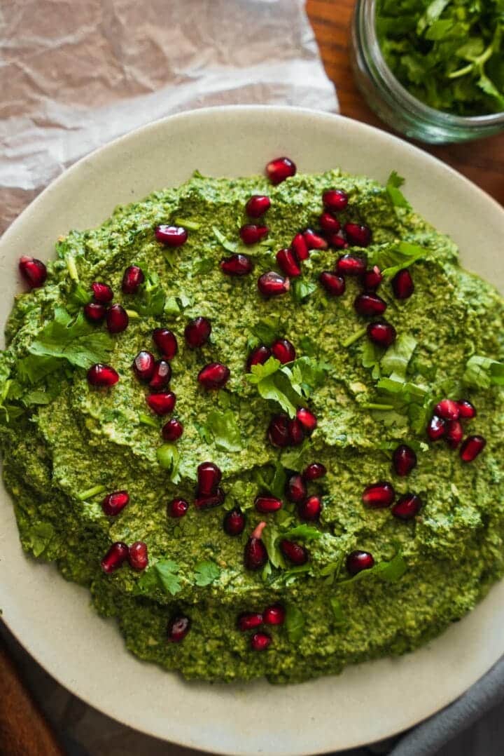 Pkhali on a plate with pomegranate seeds