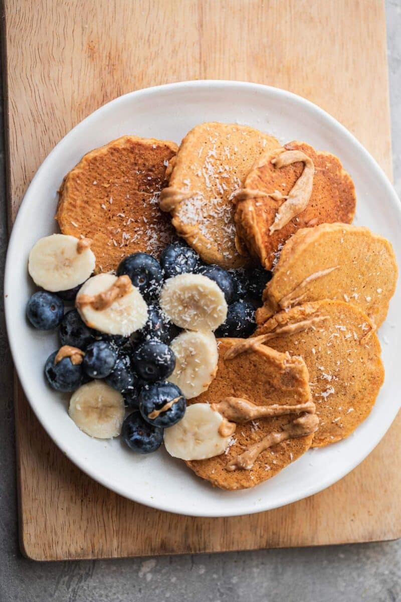 Plate of vegan pumpkins with blueberries and banana