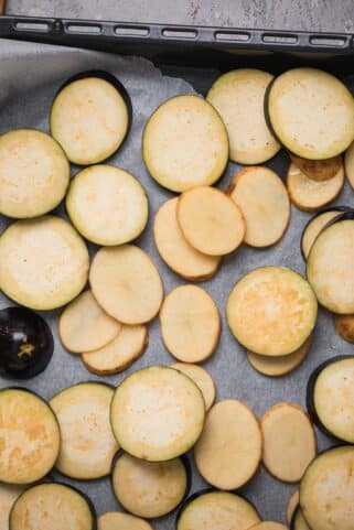 Potatoes and eggplant on a baking tray