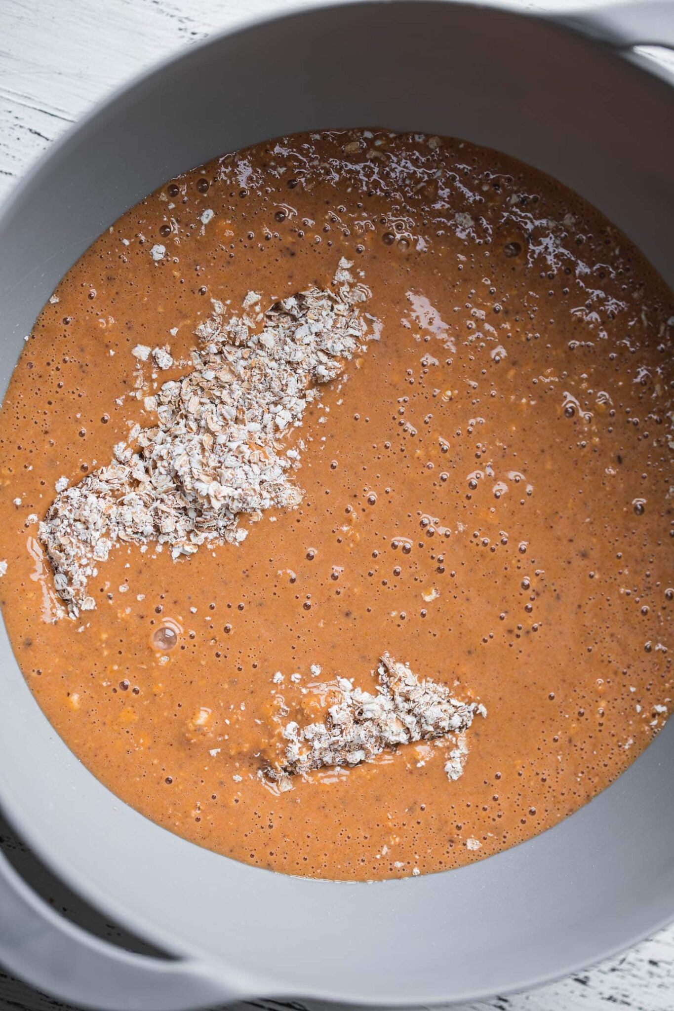 Oats, blended pumpkin mixture and chopped dark chocolate in a mixing bowl