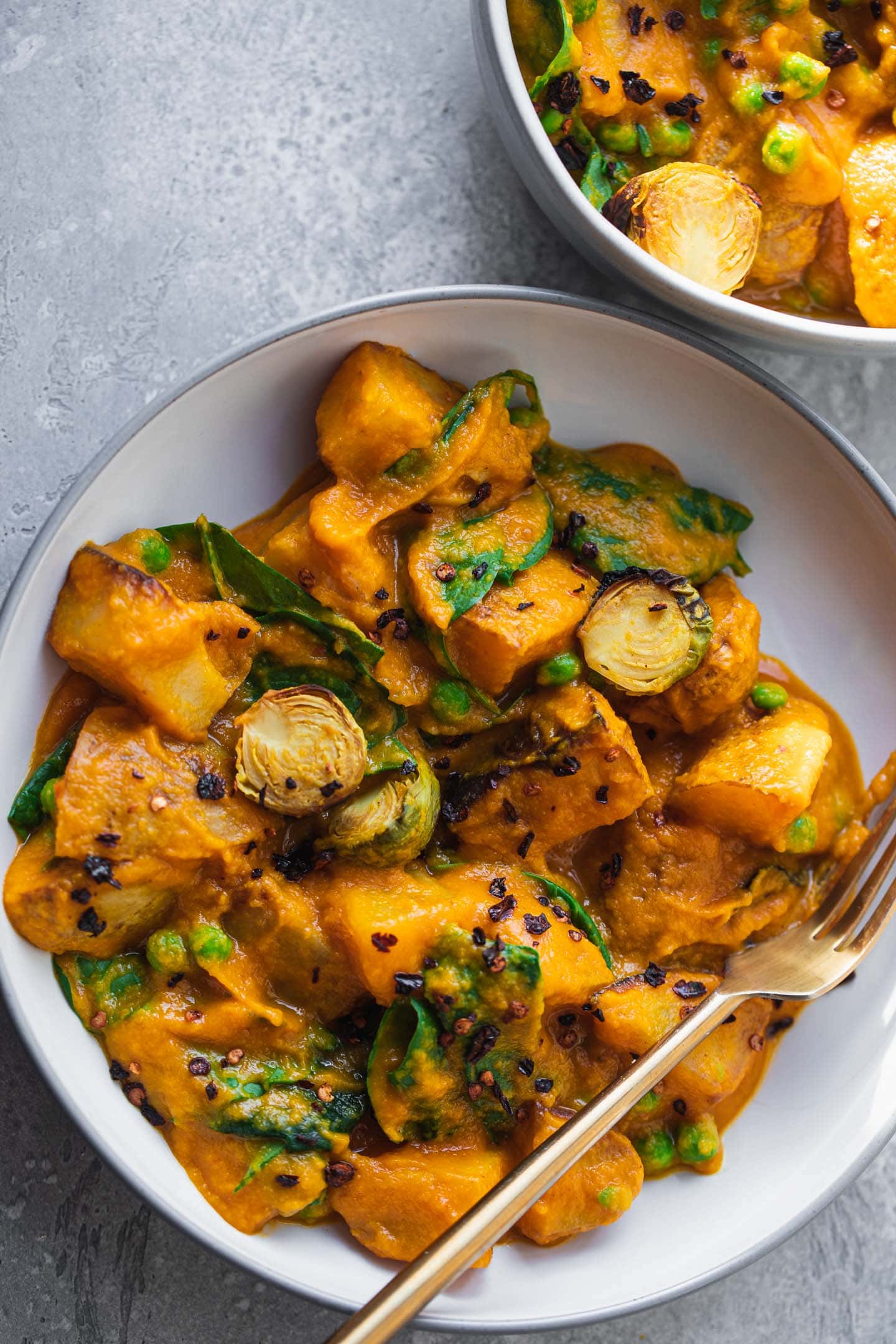 Roasted potatoes and Brussels sprouts in a 'cheesy' sauce