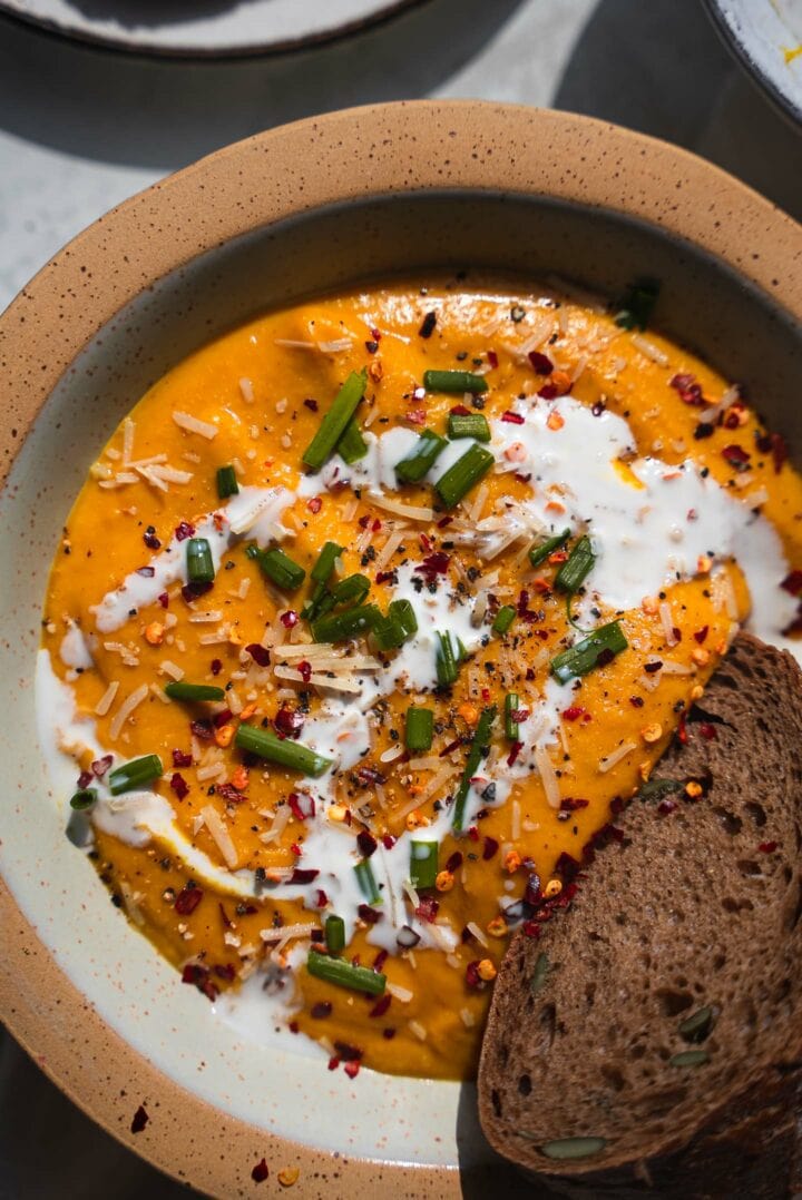 Roasted vegetable soup with coconut cream and herbs