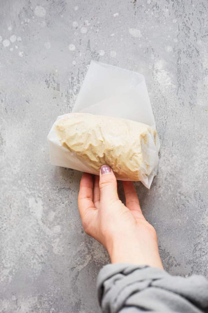 Seitan being rolled up in parchment paper