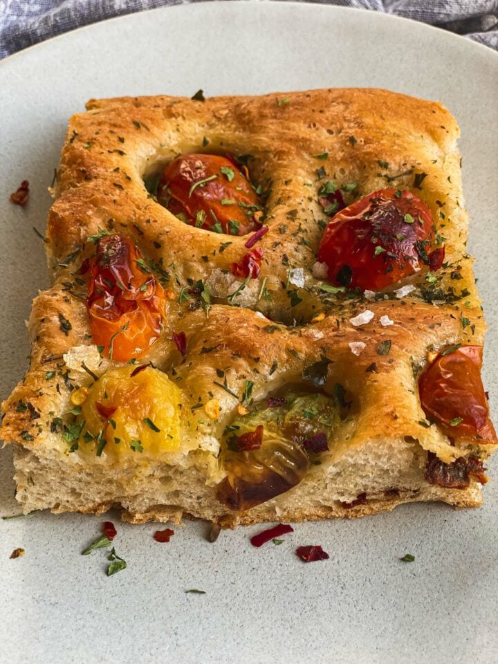 Slice of focaccia with tomatoes