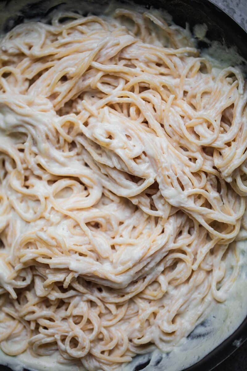 Spaghetti and dairy-free cauliflower sauce in a pan