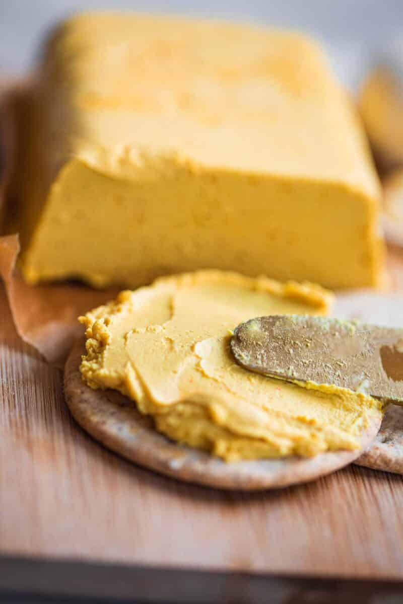 Spreadable vegan cheese on a cracker