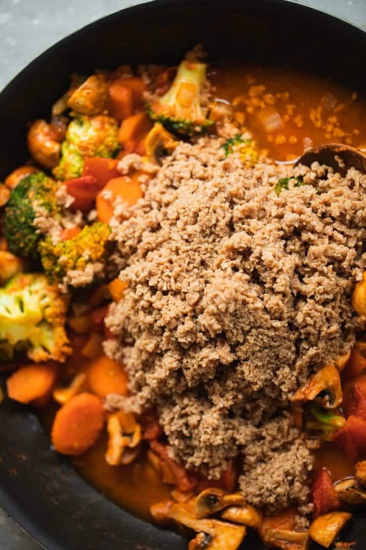 Stew with soy mince in a frying pan