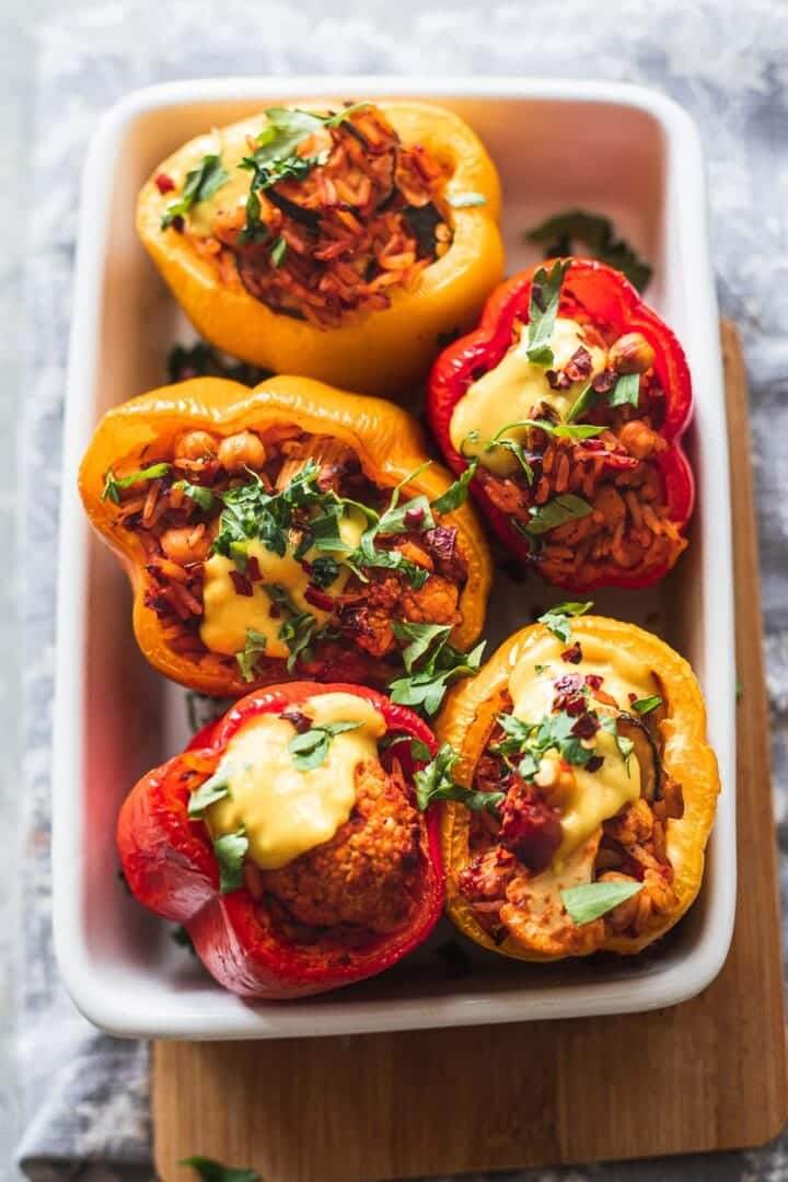 Stuffed peppers with rice and vegetables in a baking dish